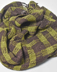Close-up of the pattern of the brown + green handwoven scarf