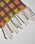 Close-up of the hand twisted fringe on this handwoven puckered scarf