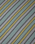 Close-up of the green striped handwoven organic cotton placemat