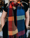 Model wearing the bright colored merino wool scarf