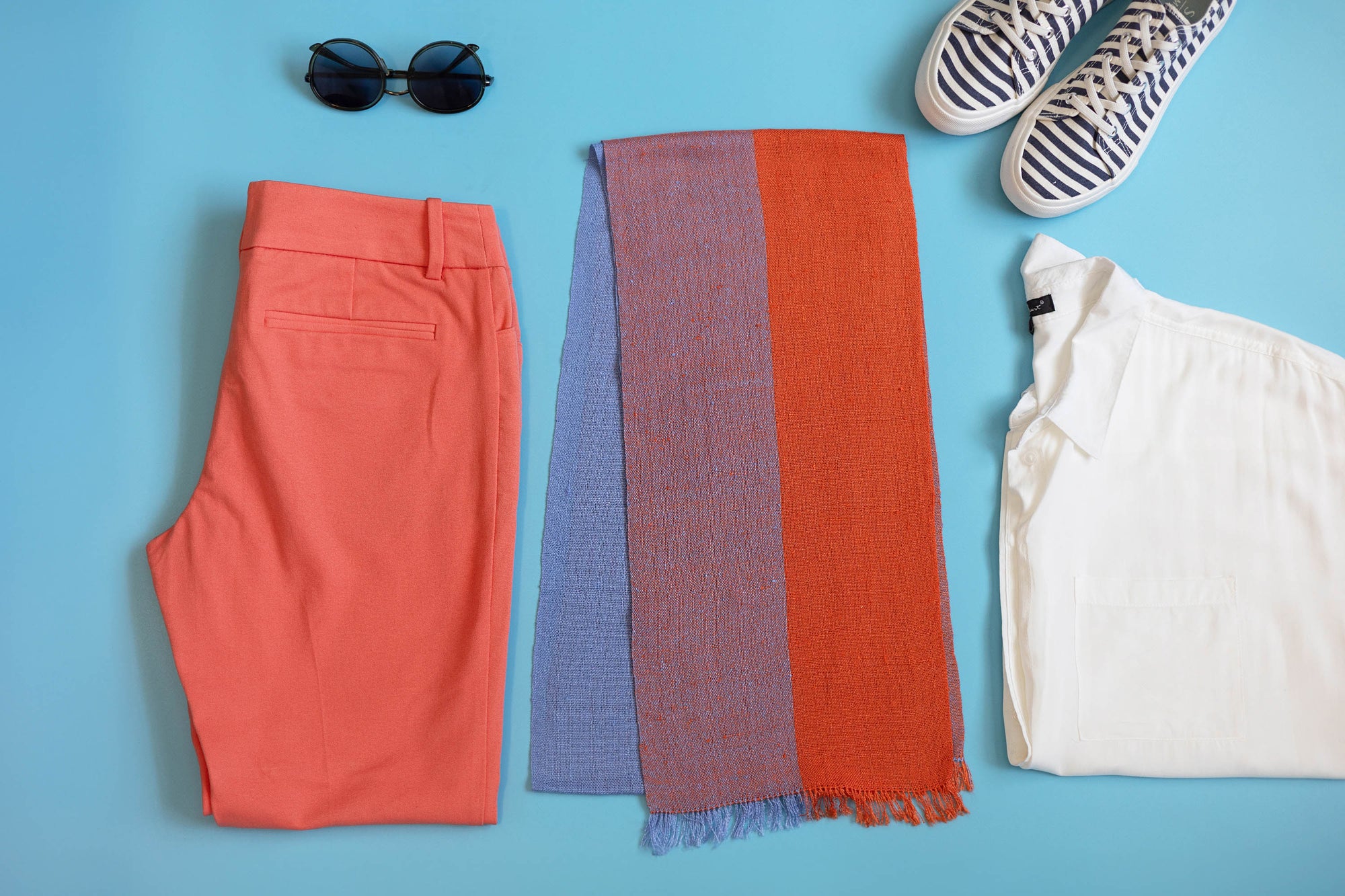 The apricot + blue scarf shown as capsule wardrobe idea