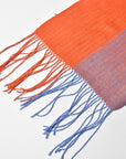 Close-up of the twisted fringe on this apricot + blue scarf