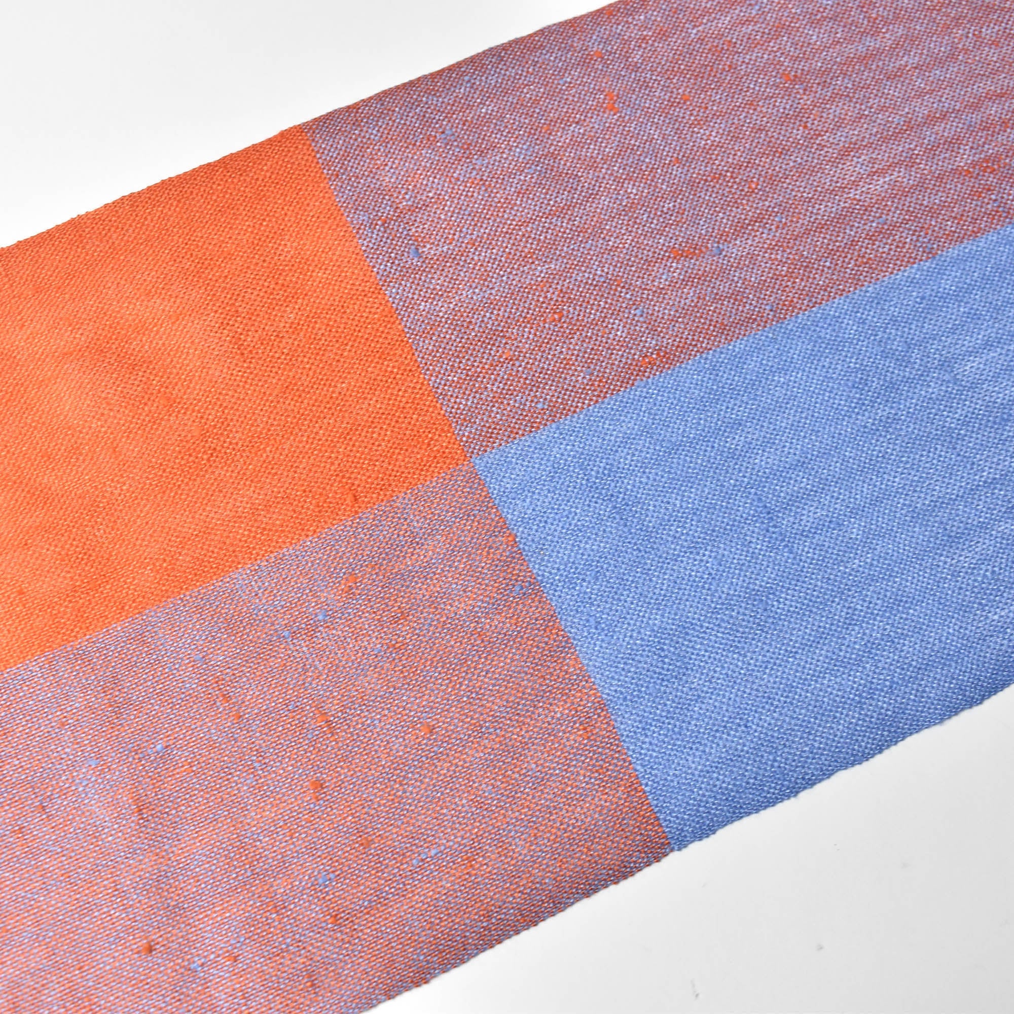 Bird's eye view of the apricot + blue handwoven scarf