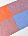 Bird's eye view of the apricot + blue handwoven scarf