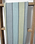 Towel made from organic cotton hanging on a wooden ladder