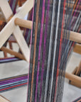 Making the warp (vertical yarns) for the black sunset scarf