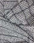 Close-up of the texture and pattern of the black+ white handwoven alpaca scarf