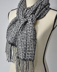 Black + white handwoven alpaca scarf on a mannequin