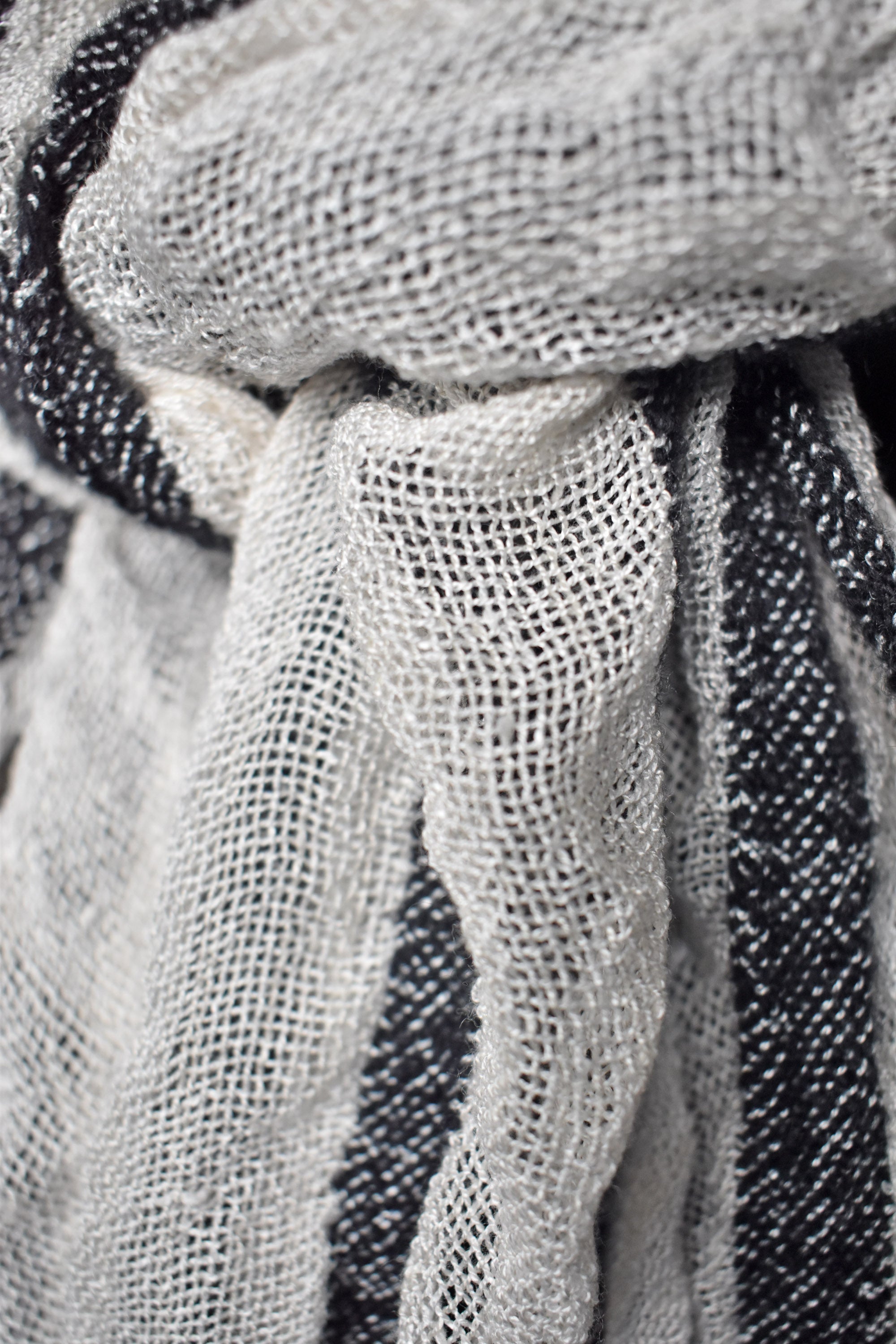 Close-up of the fabric on the black + white puckered scarf.