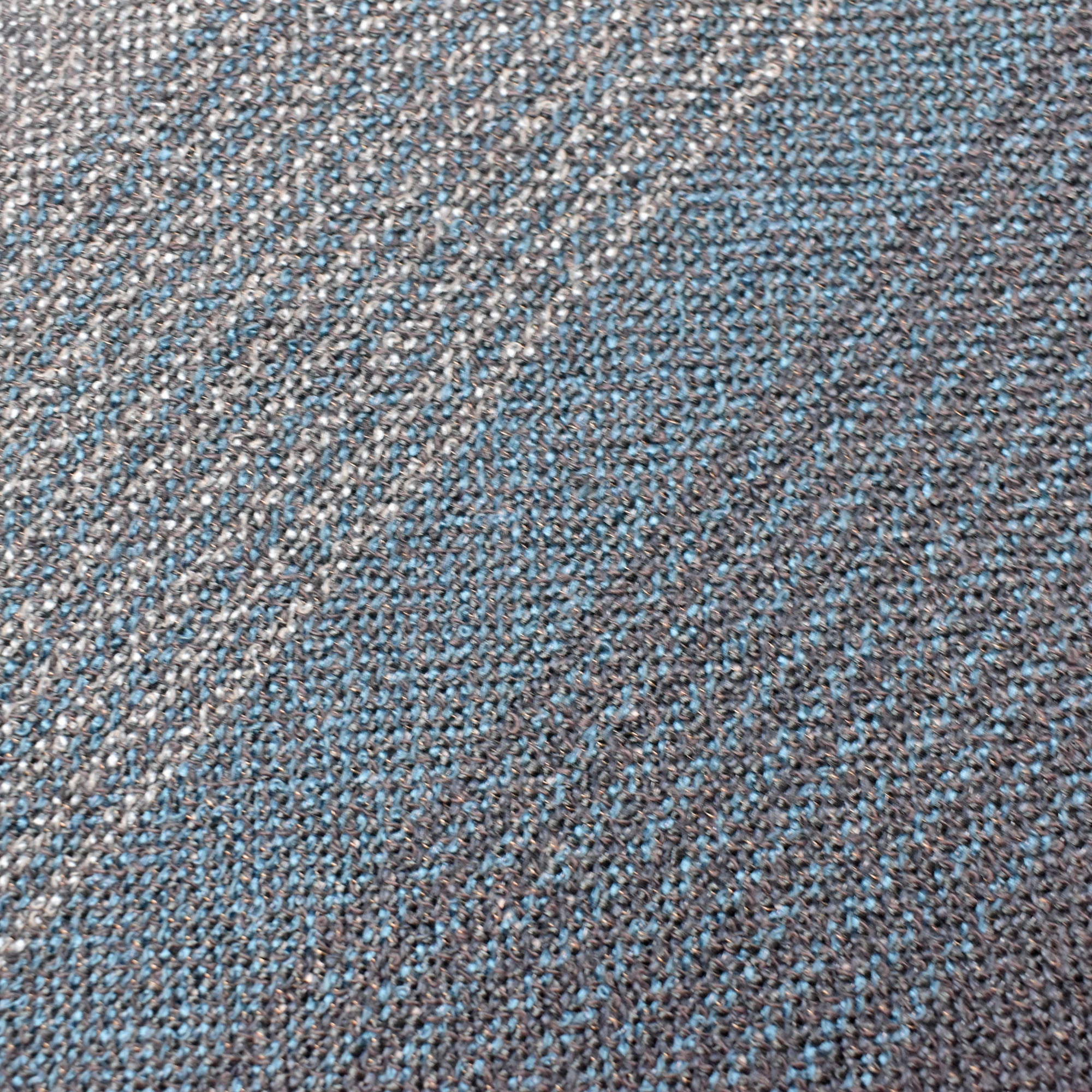 Close- up of the handwoven fabric for the blue + green scarf