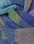 Close up of the merino wool and up-cycled viscose scarf showing the colors and texture.