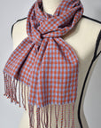 Blue + orange handwoven merino wool scarf on a mannequin