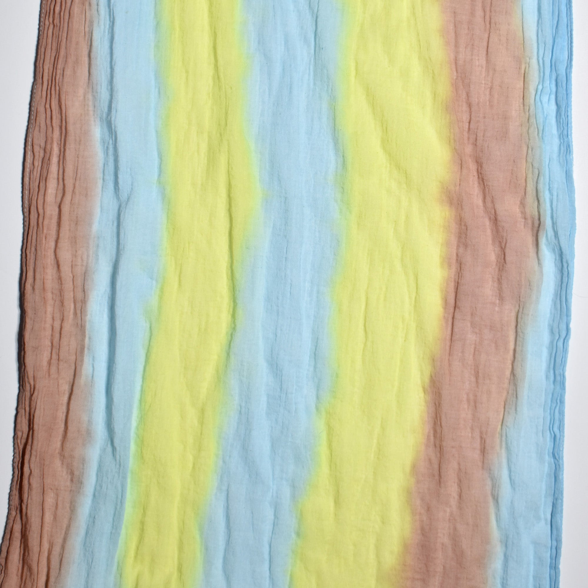 Close-up of the colors on the bold hand-painted cotton scarf