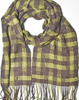 Handwoven scarf in brown + green up-cycled viscose yarn laying on a white table