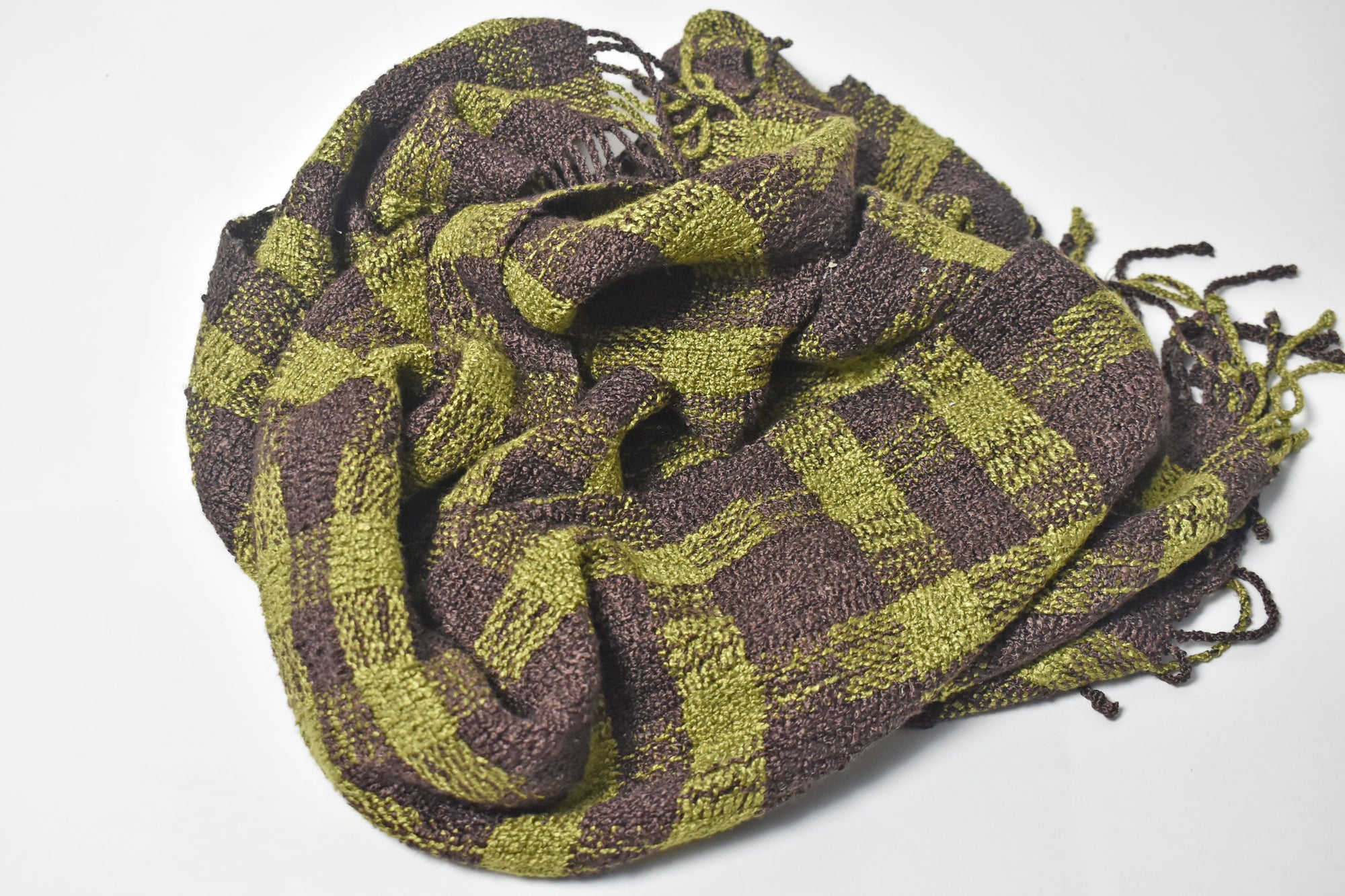 Close-up of the pattern of the brown + green handwoven scarf