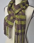 Brown + Green handwoven scarf styled on a mannequin