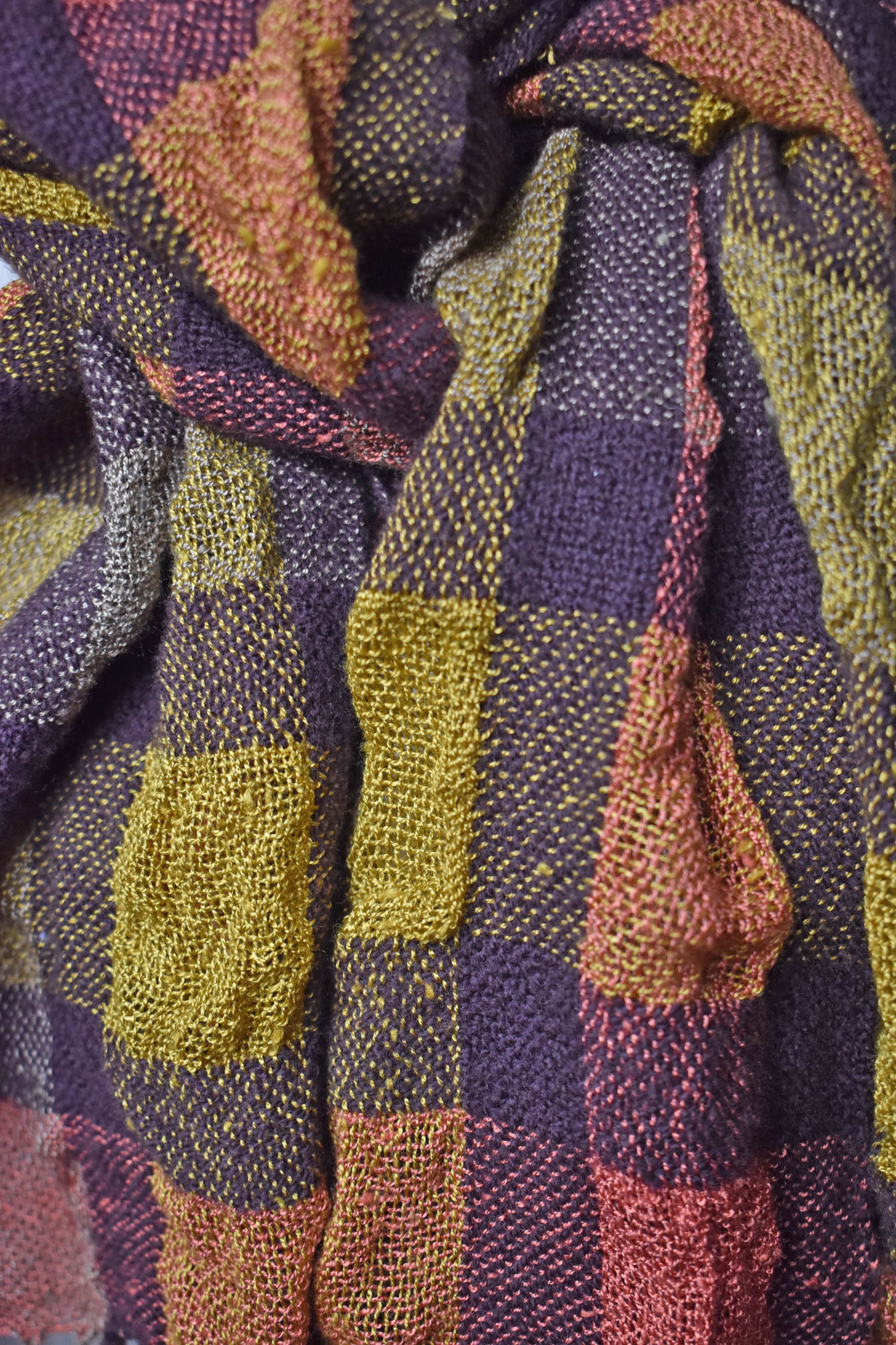 Close-up of the scarf styled on a mannequin