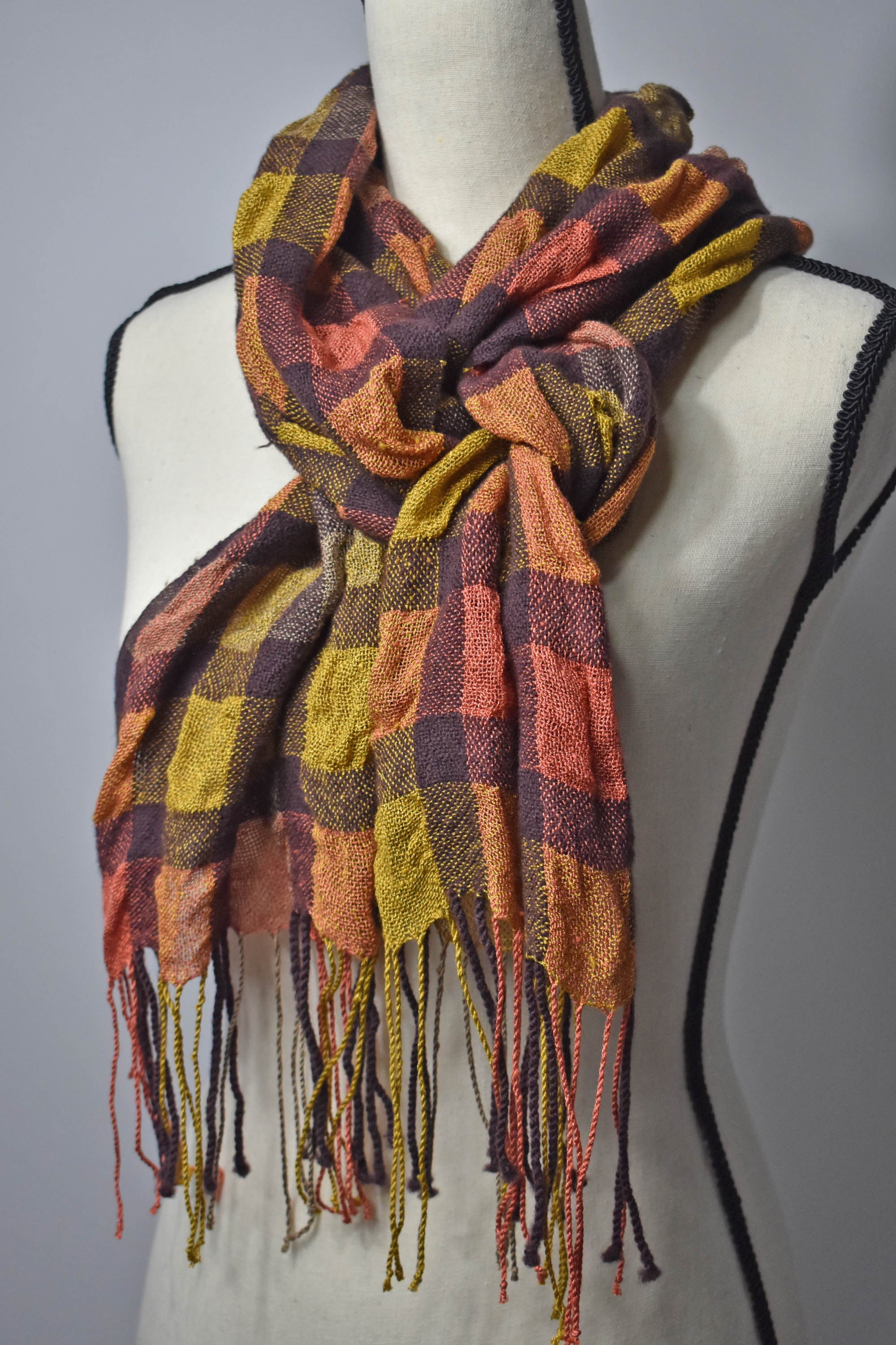 Brown wool with peach + gold up-cycled viscose yarn handwoven puckered scarf on a mannequin