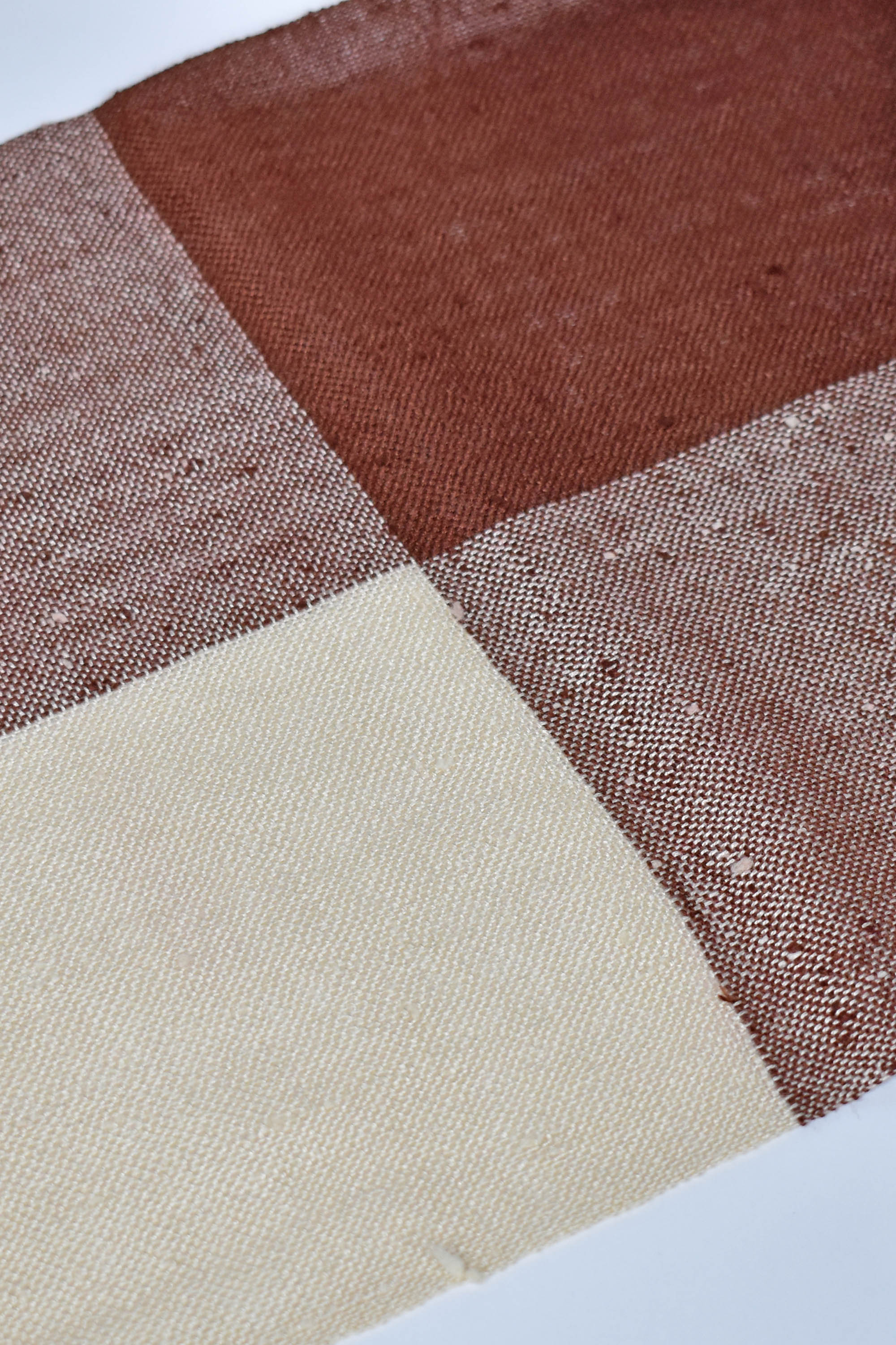 Close-up of the brown and cream colors on this handwoven scarf