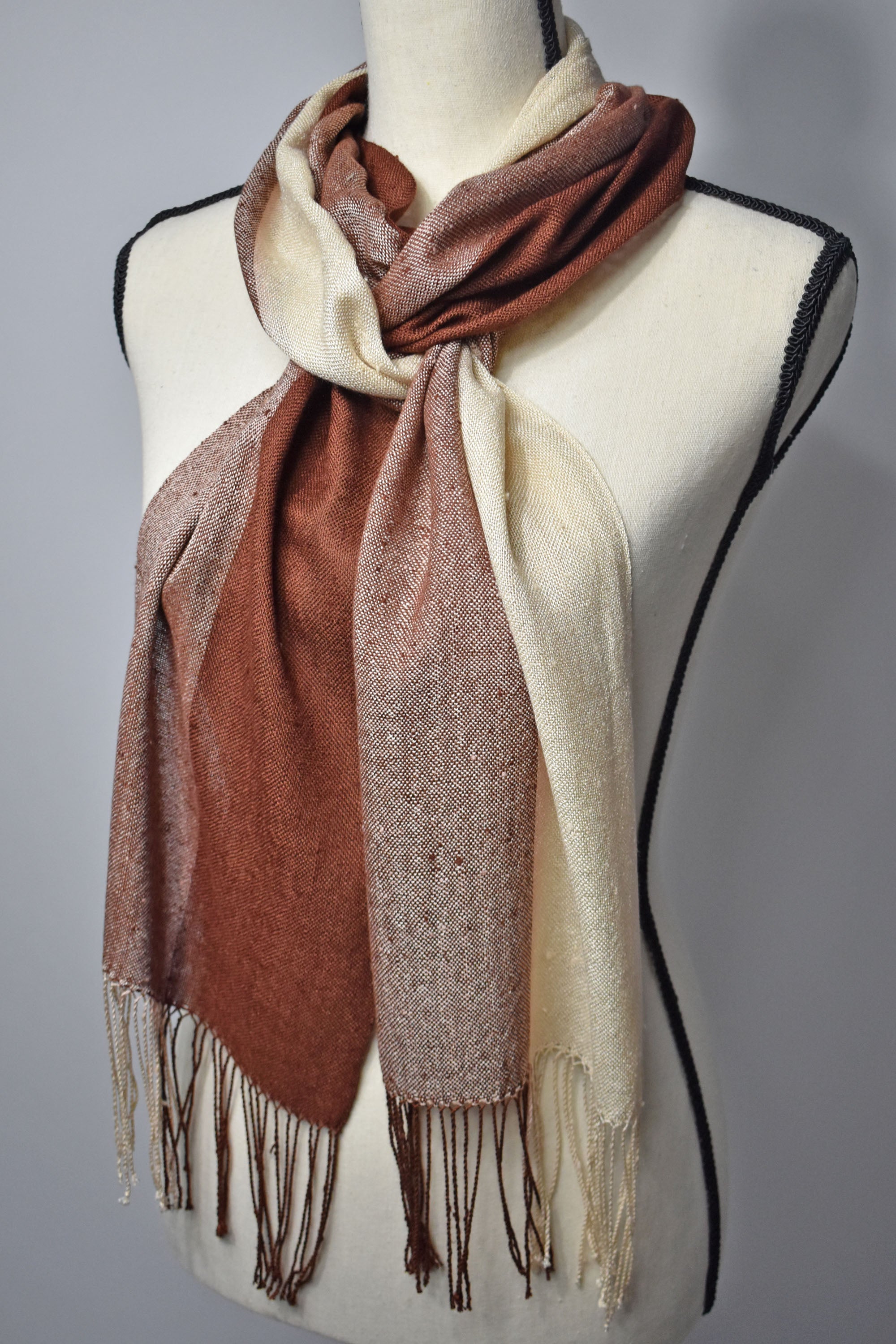 Brown + cream handwoven scarf with up-cycled exclusive yarns on a mannequin