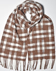 Chestnut brown + white handwoven scarf styled on a white table