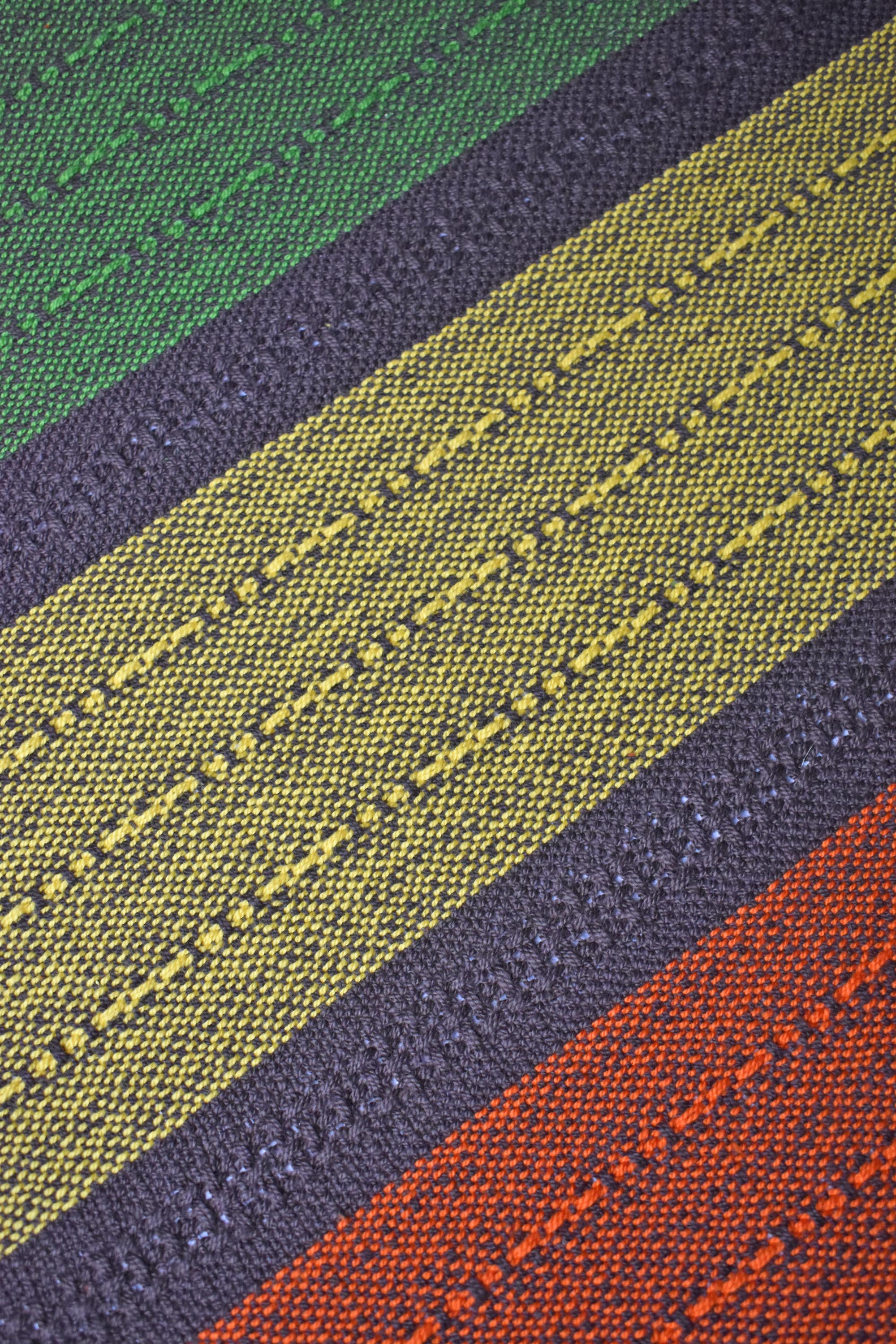 Close-up of the fall inspired handwoven organic cotton placemat