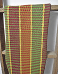 Handwoven organic cotton towel hanging on a ladder