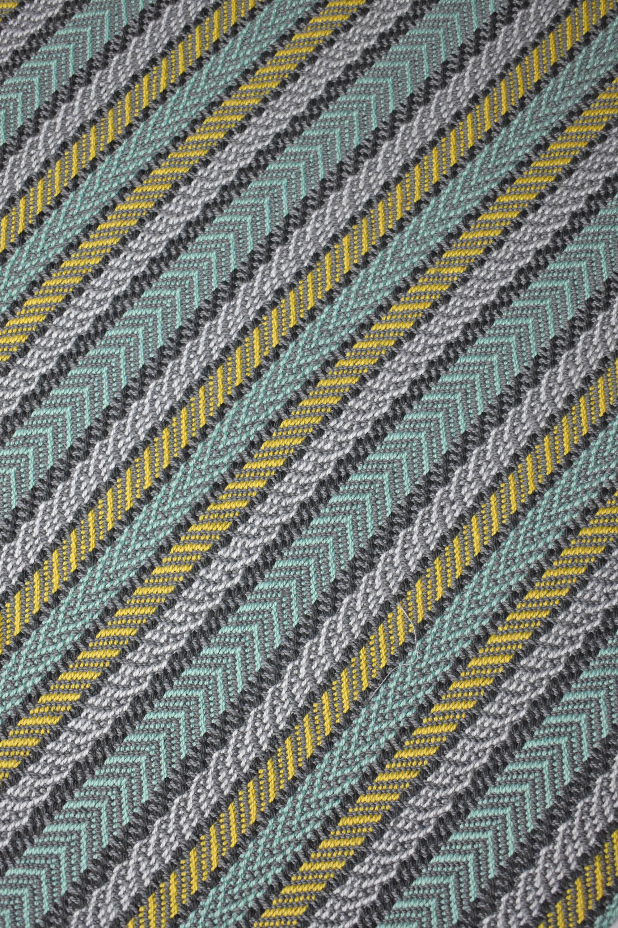 Close-up of the green striped handwoven organic cotton placemat