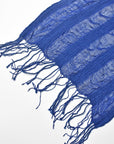 Check the scalloped edges of the hand twisted fringes on this handwoven scarf.