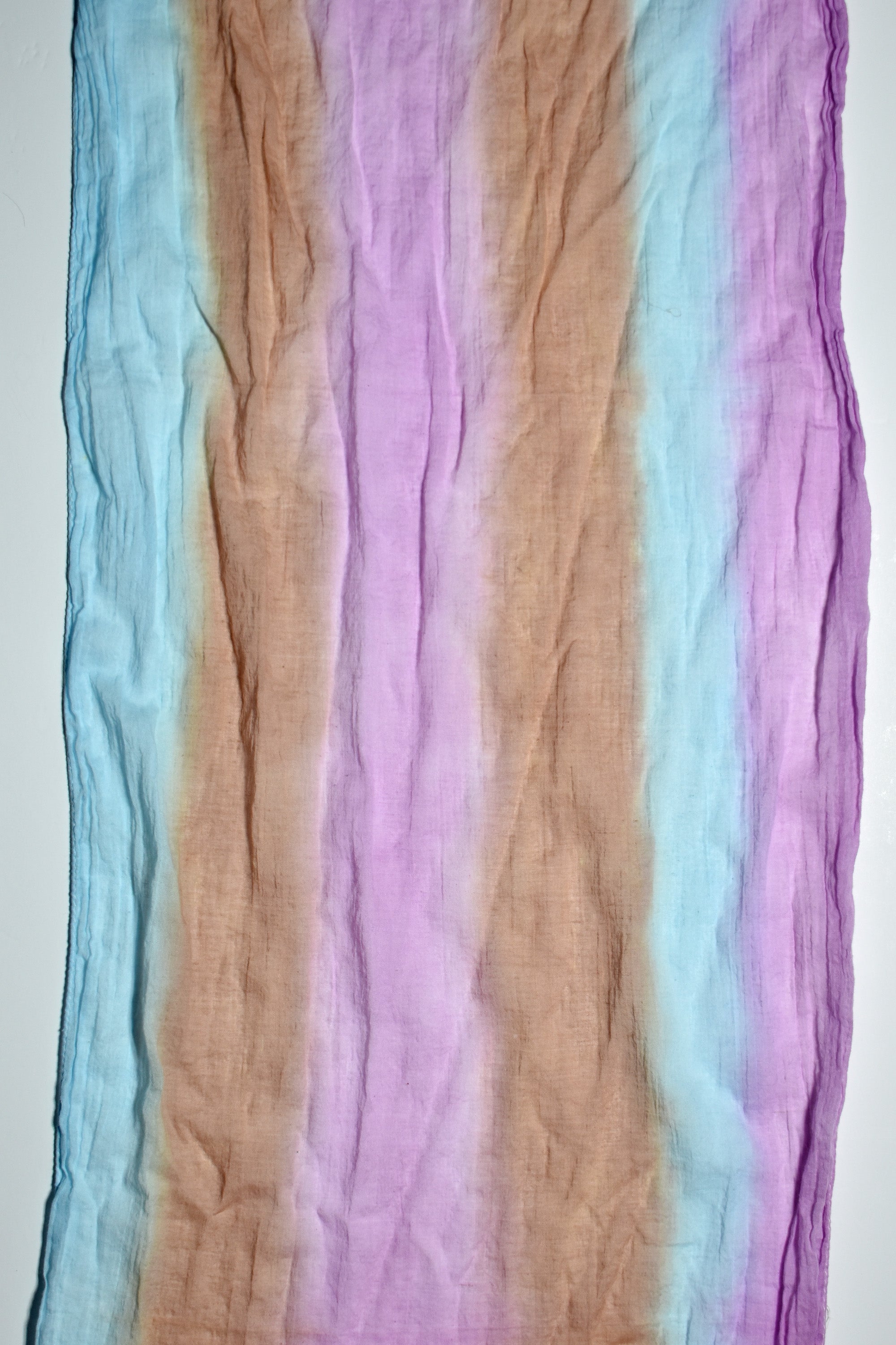 Close-up of casual multi-colored hand-painted scarf