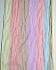 Close-up of the pastel colors of this hand-painted cotton scarf