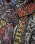 Close-up of handwoven scarf on a model