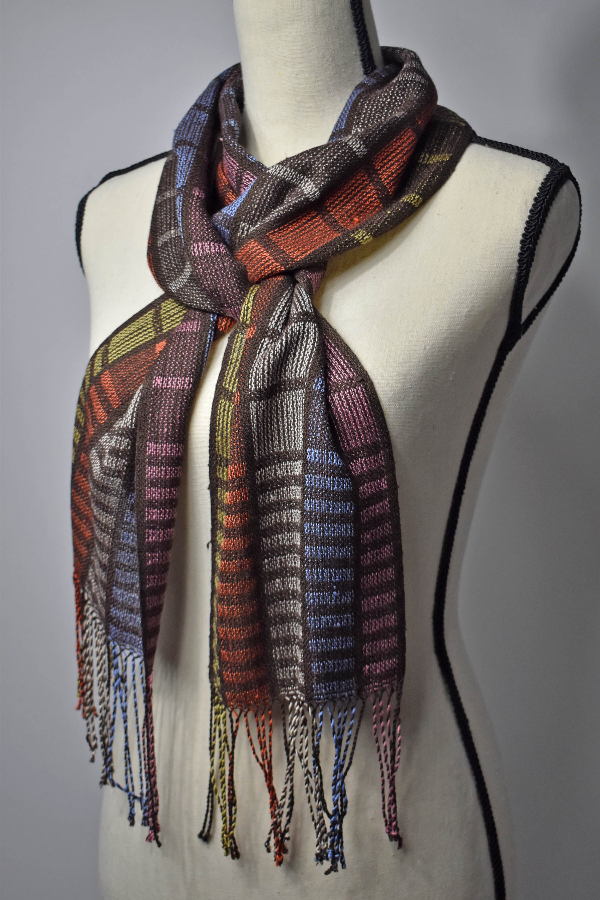 Handwoven scarf woven with up-cycled  viscose yarn on a mannequin