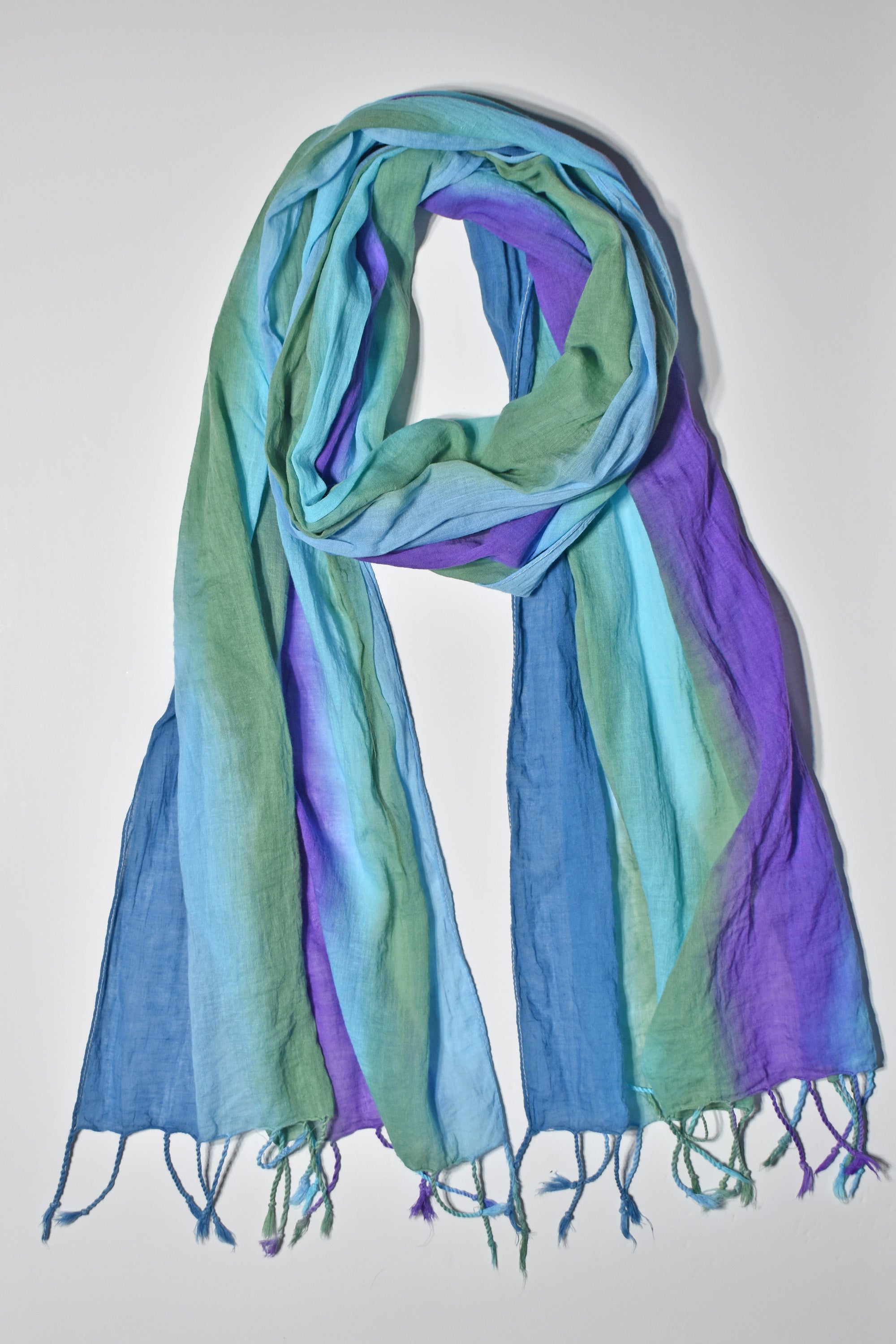 Hand-painted cotton scarf with vibrant blues and greens