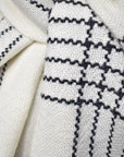 Close-up of white merino scarf on a model